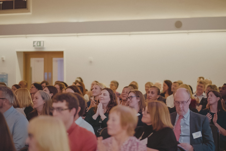 Crowd of people listening to a speech
